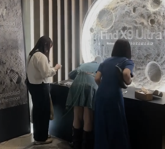 Visitors at the OPPO event display